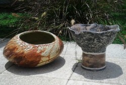 Large low fire garden pieces with earth tone glazes or oxide stains.