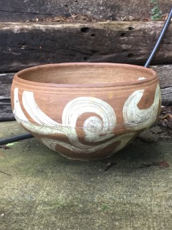 25 pound thrown and coil built open form with incised white slip decoration. 