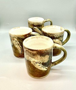 Three glaze's overlap on these Feather Mugs